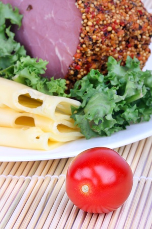 Bloated bacon,cheese and salad leaf on plate, closeupの写真素材