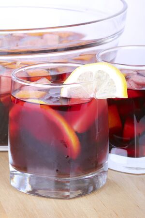 Sangria in glass bowl on wooden board, closeup の写真素材