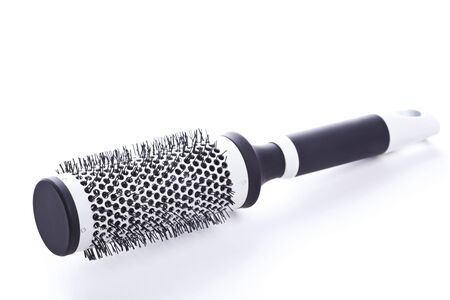 Round comb closeup on white backgroundの写真素材