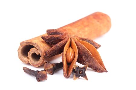 Anise and cinnamon, ingredients for preparation mulled wine, closeup on whiteの写真素材