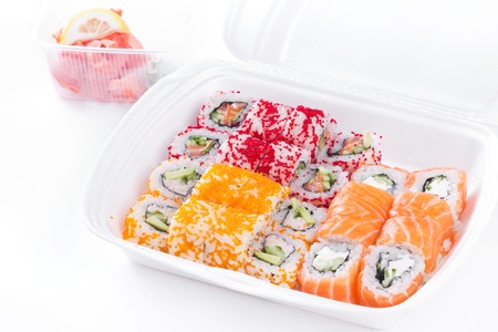 Sushi and roll assortment in box, closeup on whiteの写真素材
