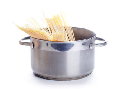 Spaghetti in pan isolated on white backgroundの写真素材