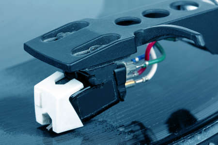Dj needle on spinning record, blue toneの写真素材