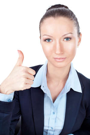 Businesswoman gesturing with a thumbs upの写真素材