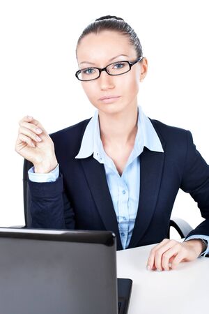 Closeup of business woman sitting with laptop in office の写真素材