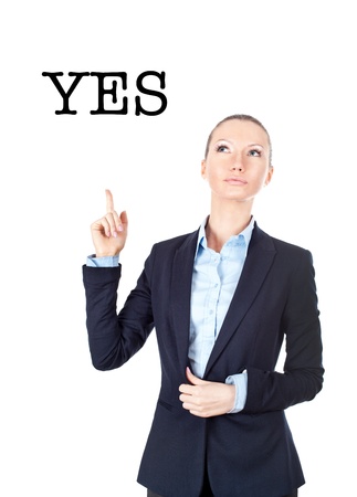 Business woman pointing up on sign yesの写真素材