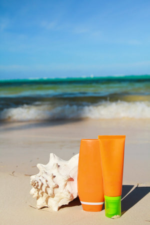 Summer protection cosmetics on a sand