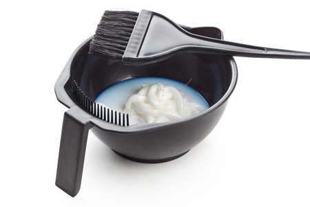 Bowl with peroxide and brush, closeup on white backgroundの写真素材