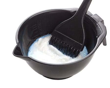 Bowl with peroxide and brush, isolated on white backgroundの写真素材