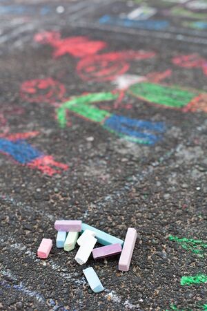 Colorful chalks on asphalt, child drawingの写真素材