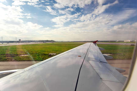 Airplane on landing strip, ready to flightの写真素材