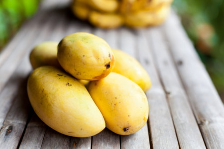 Exotic fruits closeup on wooden tableの写真素材