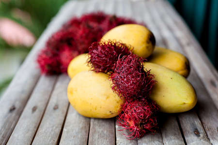 Exotic fruits close up on wooden tableの写真素材