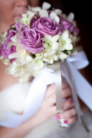 Wedding bouquet in bride's handの写真素材