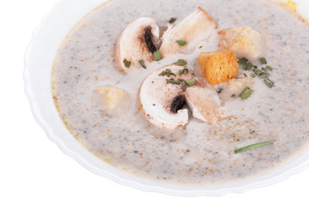 Mushrooms cream soup with agaric, closeup on white backgroundの写真素材