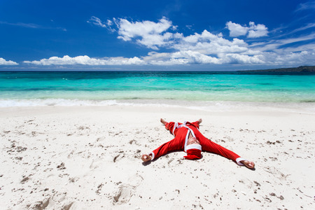 Santa Claus on beach relaxing, enjoying summerの写真素材