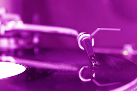 Dj turntable needle and on vinyl record の写真素材