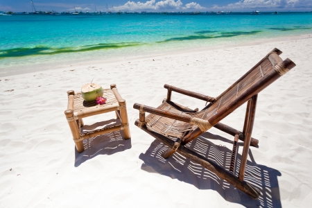 Coconut cocktail decorated plumeria near chaise-longues.の写真素材