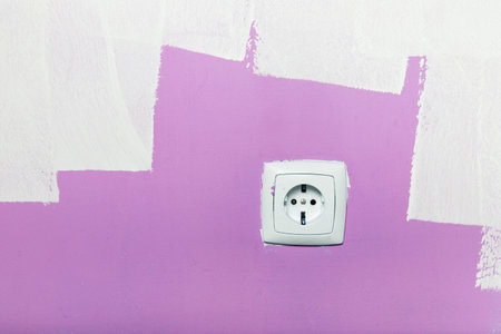 Electrical outlet on wall, interior 