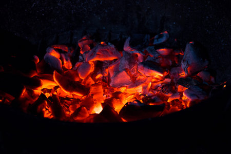 Burning charcoal in the dark, outdoors