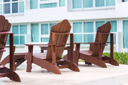 Wooden sun chair at luxury resort near hotelの写真素材