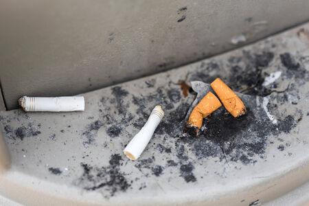 Cigarettes in outdoors ashtray, closeupの写真素材