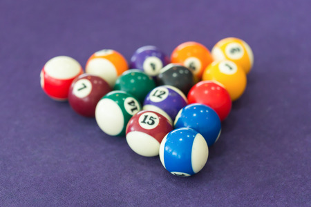 Billiard table with balls arranged in a triangleの写真素材
