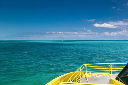 Yellow catamaran in caribbean sea, Cancun, Mexicoの写真素材