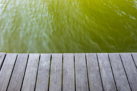 Empty wooden pier with ripple of lagoon waterの写真素材