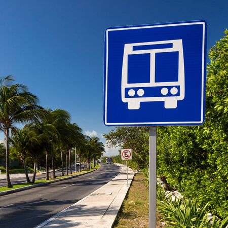 American road public bus stop sign on caribbean street roadの写真素材