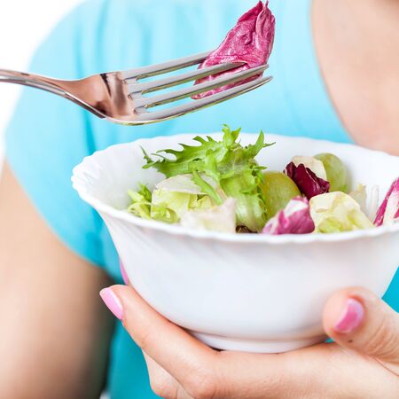 Woman eating salad, diet conceptの写真素材