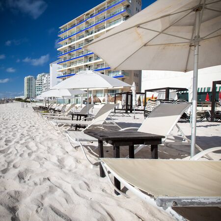 Caribbean beach with sun umbrellas and beds. Vacation conceptの写真素材