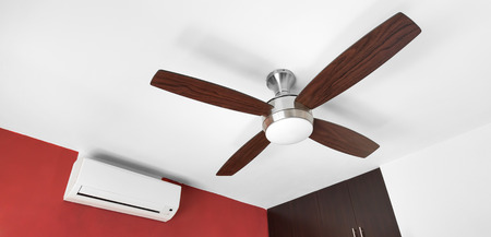 Electric ceiling fan and split-system air conditioner at the roomの写真素材