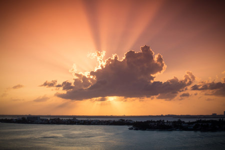 Beautiful sunset through cloudsの写真素材