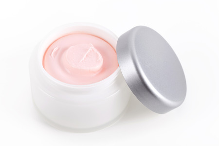 Facial cream in jar on whiteの写真素材