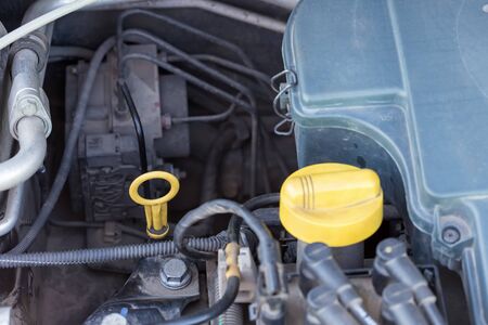 Closeup parts of  car engine. Checking oilの写真素材