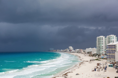 Stormy weather in Cancun, beautiful turquoise sea under dark blue clouds, view from aboveの写真素材