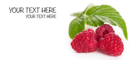 Fresh raspberries with leaf closeup on white backgroundの写真素材