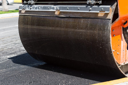 Detail of steamroller during road construction. Asphalt pavement works