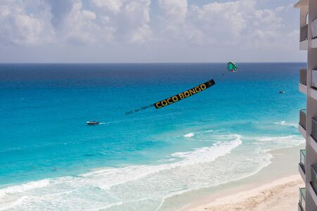 Cancun, Mexico - 8 March 2015: Advertisement beach parachute boat with sign Coco Bongoのeditorial素材