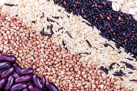 Low carbohydrates in assortment,  rice, beans and buckwheat  top view, selective focus. Healthy food conceptの写真素材