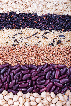 Low carbohydrates in assortment, oat, rice, beans, buckwheat and chickpeas, top view, selective focus. Healthy food conceptの写真素材