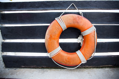 Lifebuoy ring on wooden railing