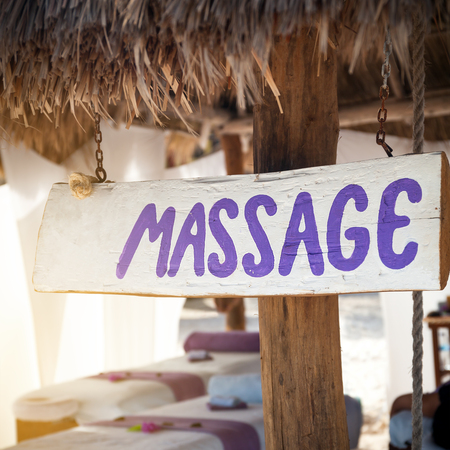 Spa massage room at beachside in bungalow, massage tables with towels, nobody. Beauty care conceptの写真素材