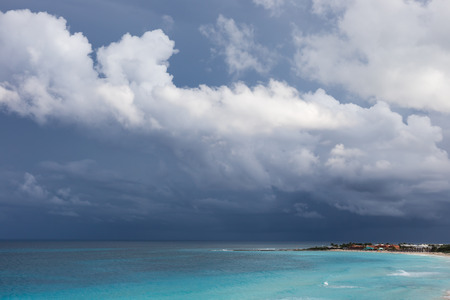 Stormy weather in Cancun, beautiful turquoise sea under dark blue clouds, view from aboveの写真素材