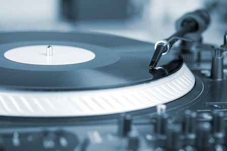 DJ needle on spinning turntable, closeupの写真素材