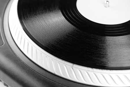 Record on spinning turntable. Listening the musicの写真素材