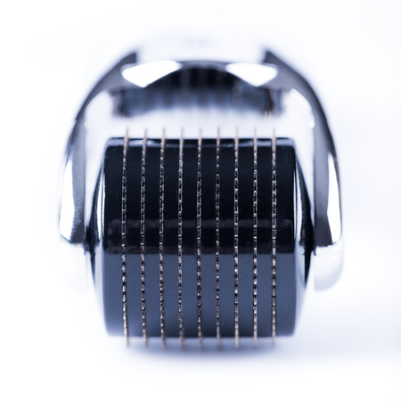 Derma Roller on white, microneedle mesotherapy for skincare, rejuvenating treatment concept.の写真素材