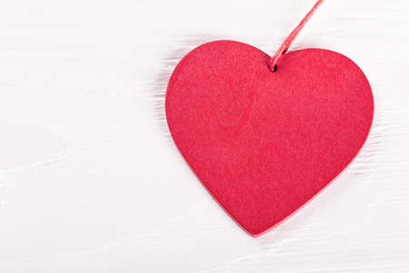 Heart shape on white rustic wooden tableの写真素材