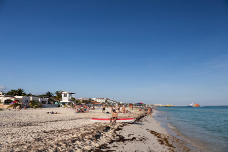 Playa Del Carmen, Mexico - 16 January 2015: People having fun on beach with different activitiesのeditorial素材
